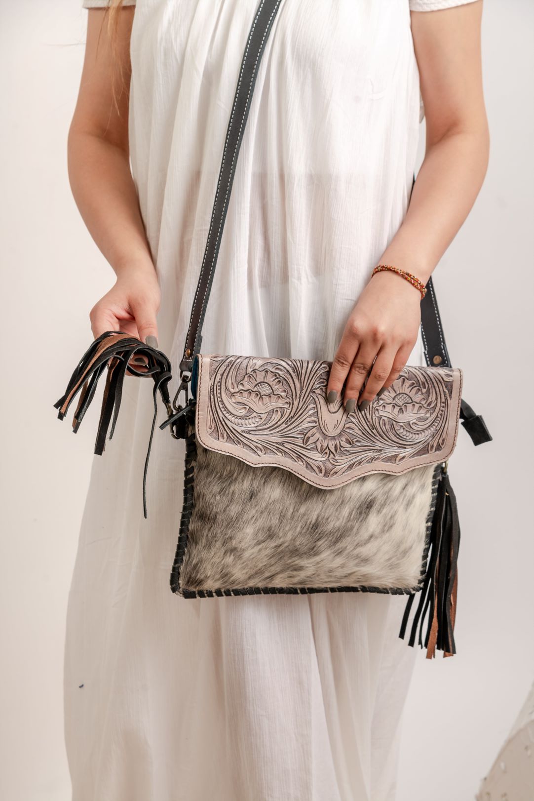 KTK5839.jpg Cowhide Tooling Carving Fringe Bag - Image 1